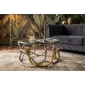 Glamour sklenen&yacute; okr&uacute;hly konferenčn&yacute; stol&iacute;k Tierra Glam s kovovou kon&scaron;trukciou v zlatej a striebornej farbe v tvare hadov 70 cm