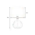 Modern&aacute; sklenen&aacute; stoln&aacute; lampa Glassy s asymetrickou transparentnou nohou a bielym textiln&yacute;m tienidlom 42 cm