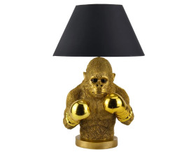 Modern&aacute; stoln&aacute; lampa Pop Atelier s čiernym okr&uacute;hlym tienidlom z textilu s roz&scaron;&iacute;renou spodnou časťou a podstavou v podobe sochy polfig&uacute;ry opice v pop art &scaron;t&yacute;le s boxersk&yacute;mi rukavicami v zlatom preveden&iacute;