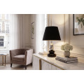 Art deco modern&aacute; stoln&aacute; lampa Caillou s podstavou s dizajnom okruhliakov v čiernej farbe so strieborn&yacute;m detailom 45 cm