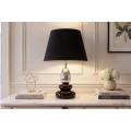 Art deco modern&aacute; stoln&aacute; lampa Caillou s podstavou s dizajnom okruhliakov v čiernej farbe so strieborn&yacute;m detailom 45 cm