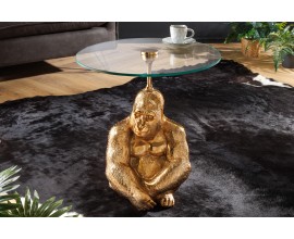 Luxusn&yacute; okr&uacute;hly pr&iacute;ručn&yacute; stol&iacute;k Wilde v art-deco &scaron;t&yacute;le s podstavou s fig&uacute;rou gorily v zlatej farbe a sklenenou doskou 51 cm