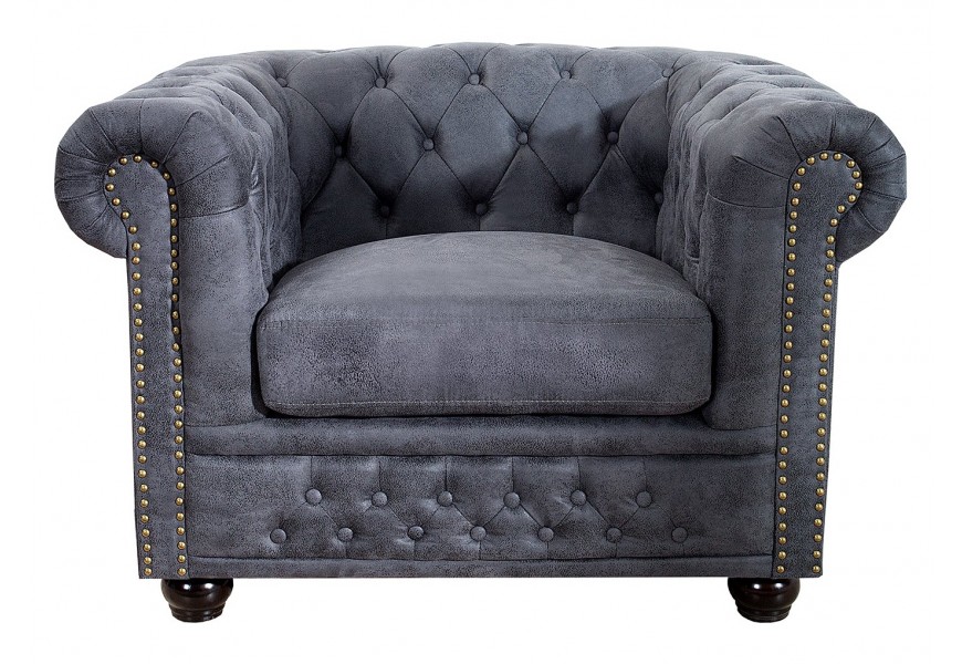 Chesterfield vintage kreslo Chesterfield Grau so zahnutými opierkami a prešívaním s hlbokými gombíkmi s guľatými tmavými nožičkami a sivým poťahom z mikrovlákna s dizajnom starožitnej kože