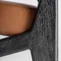Luxusn&eacute; modern&eacute; kreslo Arthen s čiernou drevenou kon&scaron;trukciou a hned&yacute;m kožen&yacute;m čal&uacute;nen&iacute;m s geometrick&yacute;mi opierkami 70 cm